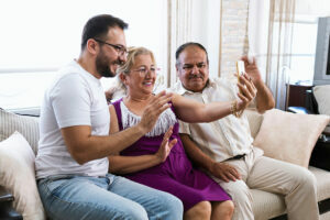 Multi generational family on safe using mobile phone for video chat